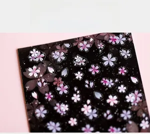 Detailed close-up of 5D ultra-thin sakura nail stickers with pink cherry blossom petals