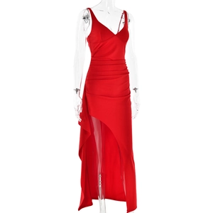Detailed view of red camisole dress featuring side ruching and a high slit design