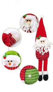 Detail of Christmas plush curtain buckles featuring Santa and Snowman with knit fabric