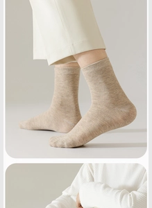 Detail of oatmeal crew socks showing fine cotton knit texture and minimalist style