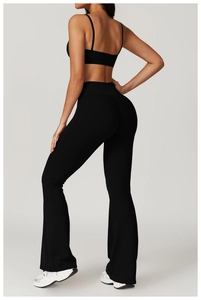Rear view of black high-waisted flared yoga pants with elastic lift effect for women