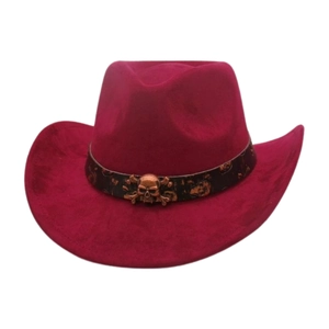 Close-up of wine red suede cowboy hat with bronze skull belt detail and western style