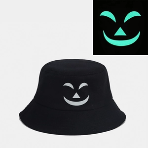 Detailed comparison of the black bucket hat with glow-in-the-dark pumpkin smile face