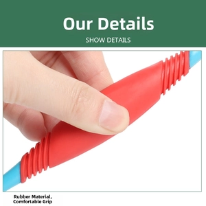 Close-up of ergonomic red rubber handle on pet toothbrush for a comfortable grip