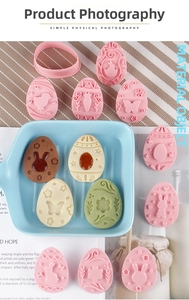 Easter egg-shaped cookie mold set with detailed rabbit, chick, and floral embossed patterns
