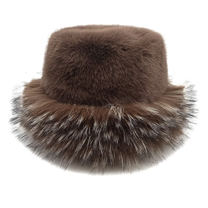 Close-up of thick dark brown faux mink fur bucket hat with soft long-haired texture