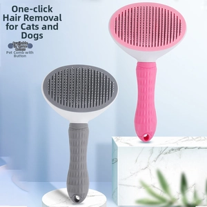Macro detail of the quick cleaning button and bristles on pink and grey pet grooming brushes