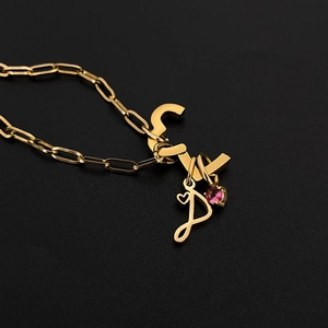 Custom gold titanium steel paperclip necklace with pink gemstone and letter pendants