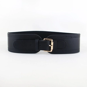 Detail of black wide elastic belt with gold buckle and double stitching for women
