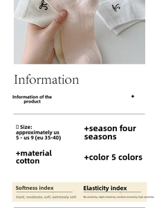 Detail of breathable white knit cotton socks with bow embroidery for women