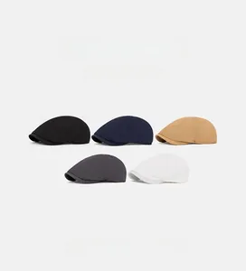 Detail shot showing five colors of breathable quick-dry flat caps in British style