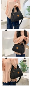 Detailed views of a black multi-compartment crossbody bag showing wear and texture