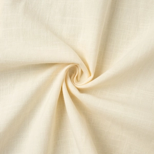 Gros plan sur la texture du tissu en coton crème respirant et les motifs tissés