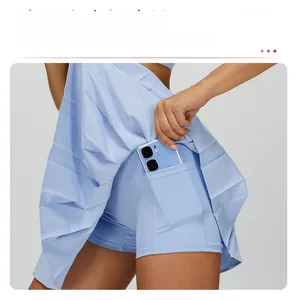 Detail of light blue pleated tennis skirt showing built-in shorts with a side phone pocket