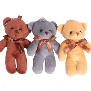 Three plush teddy bear charms in dark brown, grey, and beige for bags and keys