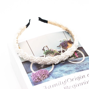 Fashionable woven white pearl headband for women featuring a 45-degree elegant view