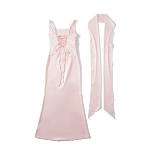 Detail of light pink satin slip maxi dress with elegant back lacing and a matching shawl