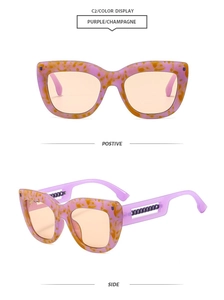 Detail of square cat-eye sunglasses with purple frames and metal chain temples