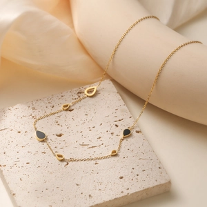 18K gold plated stainless steel necklace featuring black and hollow water drop charms