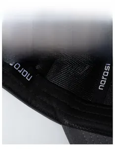 Macro detail of the sweatband area featuring moisture-wicking fabric and brand lettering