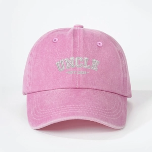 Pink washed cotton baseball cap featuring UNCLE 2025 embroidery and a retro curved brim
