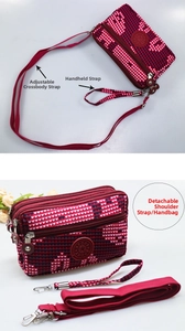 Detail view of the multi-layer zipper red heart crossbody bag with adjustable straps