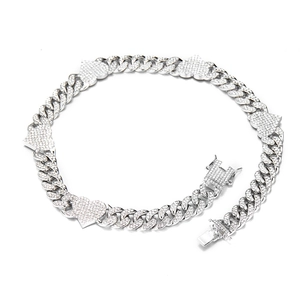 Silver Cuban link necklace with iced out heart pendants on a clean white background