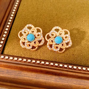 Vintage flower earrings with blue turquoise stones and small white diamonds in gold finish