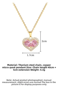 Macro shot of pink heart zircon pendant with white micro-diamonds on gold titanium chain