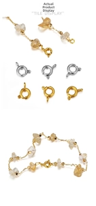 Detail of round spring clasps in gold and silver with a raw citrine stone bracelet