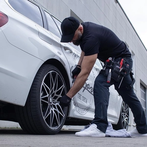 Professional Oxford cloth tool belt bag for electricians shown during car maintenance