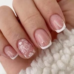 Classic French short press-on nails with white tips, glitter, and autumn maple leaf art