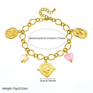Detailed view of ocean-themed gold charm bracelet with 16cm plus 4.5cm length measurements