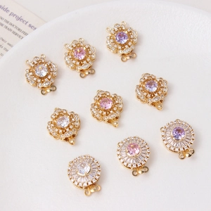 Close-up of 14K gold plated flower pearl clasps with cubic zirconia for jewelry making