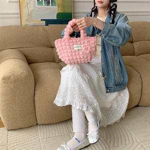 Detailed view of pink bubble textured canvas tote bag with Love Sozakka label