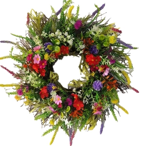Colorful spring wildflower wreath with ranunculus and green leaves on white background
