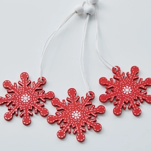Set of 3 red wooden snowflake Christmas ornaments with white stitching details