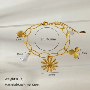 Detail showing 18K gold plated stainless steel bracelet with heart and floral charms