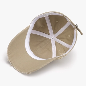 Internal view of khaki distressed 100% cotton baseball cap with adjustable metal buckle