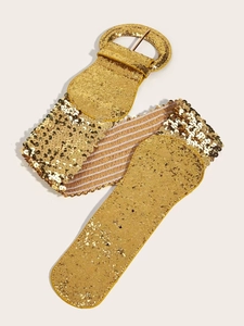 Detail view of wide gold sequin elastic waist belt with a round pin buckle and shimmer