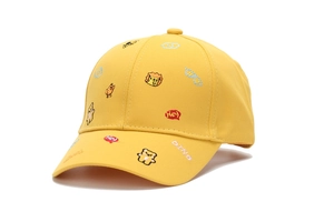 Close-up of yellow kids baseball cap with cute cartoon animal embroidery patterns