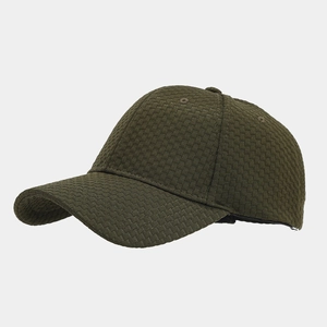 Close-up of deep green waffle weave fabric and texture on the vintage baseball cap