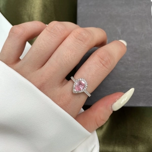 Elegant S925 sterling silver ring with pear-shaped pink gemstone and halo zircon settings