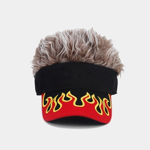 Detail of fire embroidery on the brim of a baseball cap with synthetic hair toupee