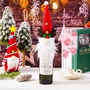Festive Christmas gnome wine bottle cover with reindeer antlers and bells decoration