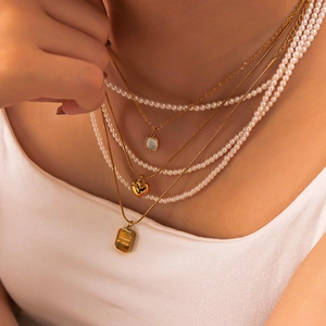 Vintage style gold-layered pearl necklace with heart and shell square pendants