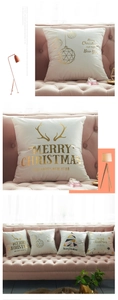Detailed view of Merry Christmas gold foil stamping on soft cream velvet pillowcase