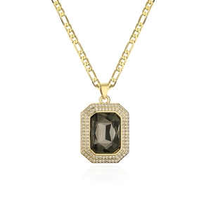 Gold Figaro chain necklace with a grey gemstone pendant surrounded by zircon crystals