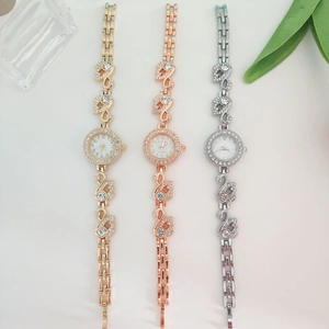 Detailed view of swan-shaped luxury quartz watches with rhinestones in gold, rose gold and silver