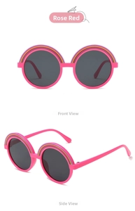 Macro detail of rose red round sunglasses for kids with rainbow stripe frames and dark lenses